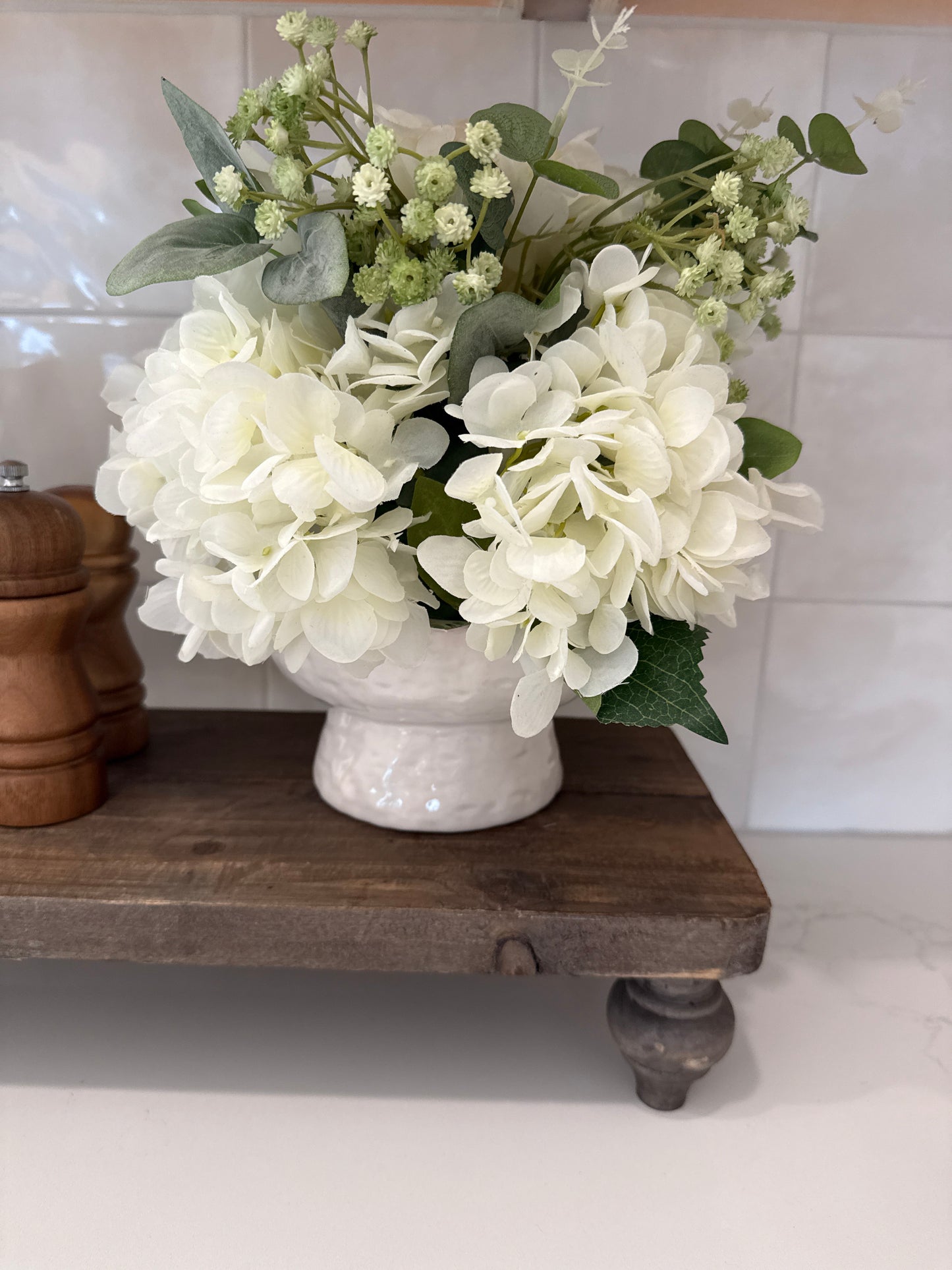 Small Hydrangea arrangement in white vase￼