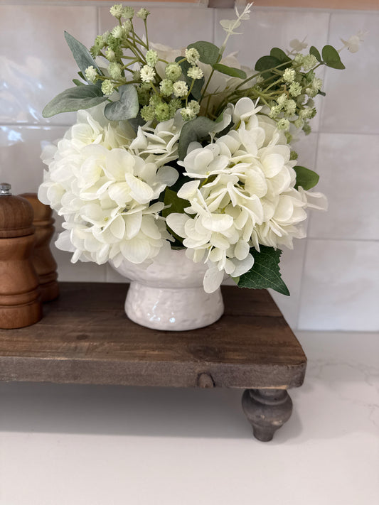 Small Hydrangea arrangement in white vase￼