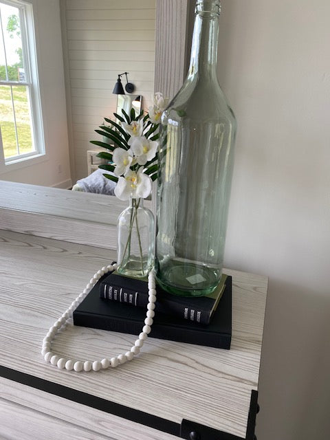 Faux Orchid in Glass Bottle